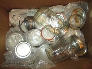 Assorted size canning jars and lids