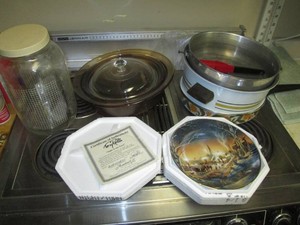 Vintage pots and pans, glass bakeware and Terry Redlin collectible display plate