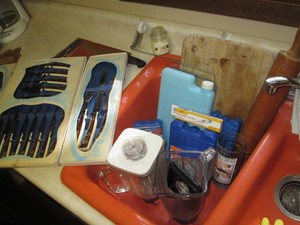 Wood cutting board, rolling pin, glass blender carafes, reusable ice packs and misc cutlery