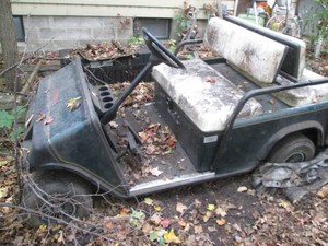 EZ-Go double-up gas powered golf cart with 2-bench seats, trunk storage, hand rails, standing platform and lights will need work to be operational