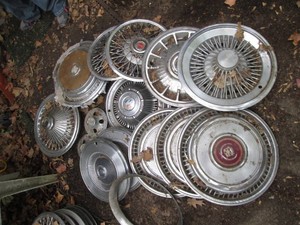 Cluster of assorted makemodel vintage hub caps