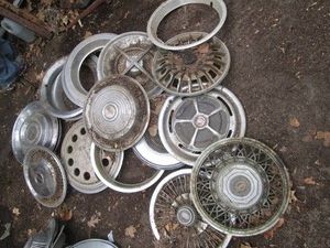 Variety of assorted makemodel vintage hub caps