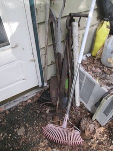 Vintage pick-axe, shovel, rakes, pry bar and misc metal tool type handles