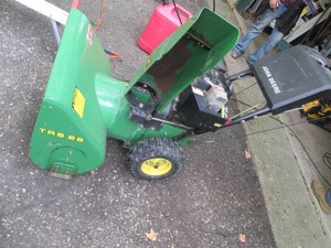 John Deere TRS26 Gas powered snowblower with separate augermovement hand controls, 6-forward and 2-reverse gears functions as intended, started on 1st pull