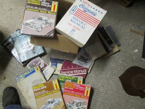 Bundle of automotive manuals and reading materials