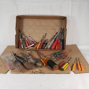 Lot of assorted screwdrivers and hand tools including Phillips and flathead screwdrivers, Allen wrenches, and specialty drivers