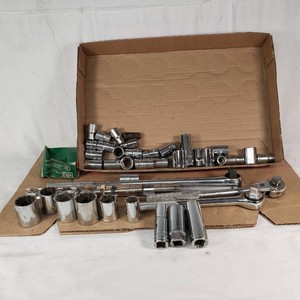 12 Drive Sockets including Ratchets, Extensions, and Various Sockets - Including some Thorson Tools