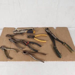 Lot of assorted hand tools including Masterforce pliers, Vise Grip pliers, and various wire and side cutters