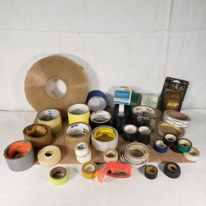 Lot of various tapes and dispensers including Duck Tape, Scotch, and 3M brands, featuring packing, masking, electrical, and transparent tapes