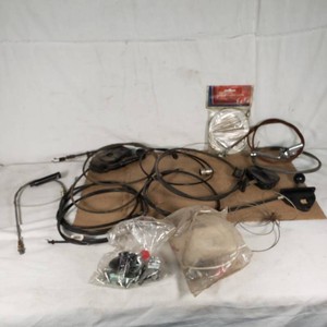 Mix of automotive control cables including OREGON cables, Dorcy caliper brake cable, and TurcoLite components