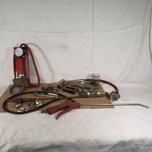 Lot of Air Tools and Accessories Including Foot Pump, Pressure Gauges, and Hose Attachments
