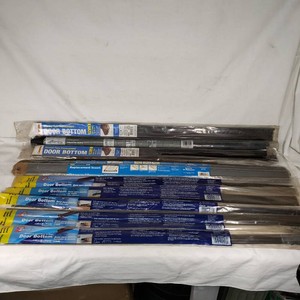 Lot of door bottom inserts including Dennis Self-Adhesive Vinyl and Stanley-Type Replacement models