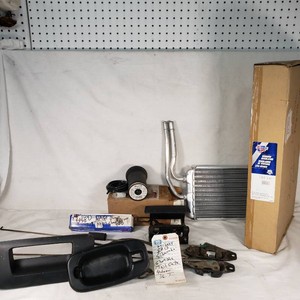 AC Delco Heater Core, Bosch Fuel Pump, Carquest Window Regulator, and Other Automotive Parts Lot including Bostrom Air Spring, Latch Assemblies, and Additional Accessories