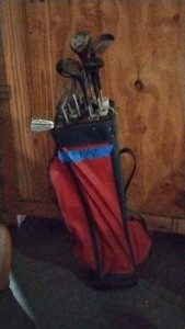 red golf bag with 12 clubs