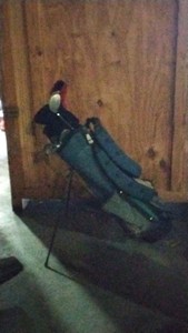 blue and gray golf bag with clubs