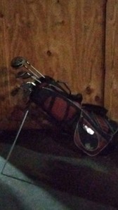 red golf bag with 10 clubs