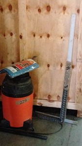 shopvac, tap, rulers, and levels