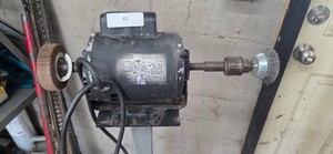 Motor with wire and sanding wheels