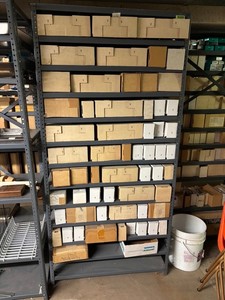 Metal Shelving Unit With Empty Storage Boxes