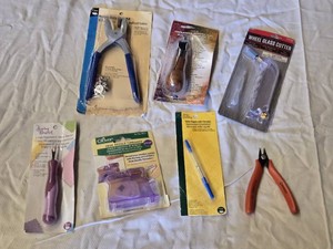 Crafting Tools and Supplies Lot including Wheel Glass Cutter, Lockstitch Awl, Heavy Duty Snap Kit, Desk Needle Threader, and More