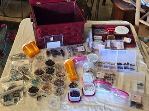 Lot of Bead and Jewelry Making Supplies includes a variety of beads, jewelry wire, and crafting tools stored in a red woven basket