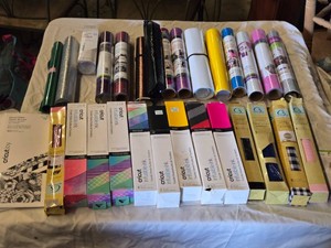 Cricut and Vinyl Crafting Supplies Lot including Infusible Ink Transfer Sheets, Vinyl Rolls, and Cutting Accessories
