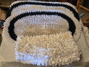 Lot of Bath Rugs Including Black and White Striped Design and Solid White Design