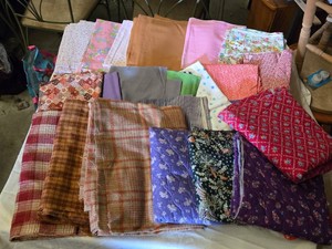 Assorted Fabric Pieces including Various Patterns and Colors