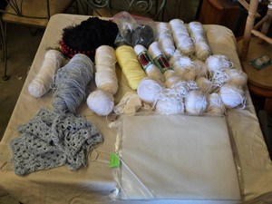 Yarn and Knitting Supplies including Various Yarn Balls, Loom, and Crocheted Piece Set, Craft Canvas