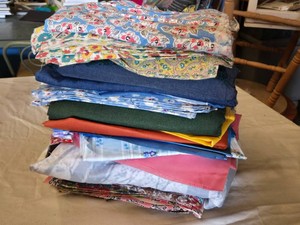 Lot of Various Fabric Pieces Including Floral, Denim, and Solid Colors