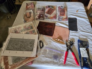 Leather Crafting Supplies Lot including Checkbook Kit, Journal Kits, Hole Punch, and Crafting Tools - Some pieces are stamped already