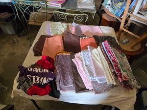 Collection of Various Fabric Pieces for Crafting and Sewing Projects
