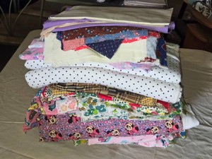 Assorted Fabric and Quilting Material Lot with Various Patterns and Colors