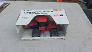 132 scale Ertl Case International Four-Wheel Drive Tractor (such as the Case IH 9150 Special Edition) in its original open-front display box.