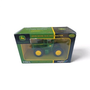 132 scale ERTL John Deere 7020 4WD Tractor (Stock Number 15610) featuring die-cast metal construction, single wheels, an articulating body, and a cab