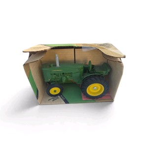 116 scale Ertl John Deere Model M Farm Toy Tractor (Stock #540  Series III) packaged in its original collector box.