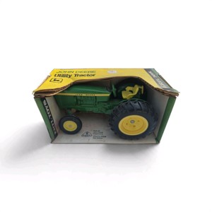 116 scale ERTL John Deere Utility Tractor (Model #516) packaged in its original yellow and black ERTL Toys box