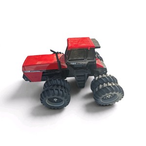 vintage Case International 4994 4-wheel drive toy tractor (labeled with 4994 on the cab and International Case on the body).