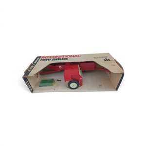 Vintage 116 Scale ERTL International Harvester Square Hay Baler in its original box, a die-cast farm toy produced around the 1970s.