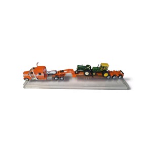 164 scale diecast model of an orange Peterbilt semi-truck pulling a Fontaine lowboy trailer with a jeep, stinger, and John Deere tractor loads.