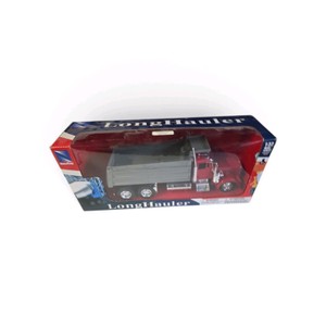 New in Box 132 scale New-Ray LongHauler diecast model featuring a red semi-truck cab with a gray dumpcement-style bed