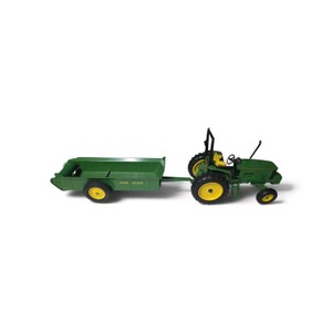 Vintage Green John Deere toy farm tractor with a wide-front axle hitched to a green John Deere manure spreader.