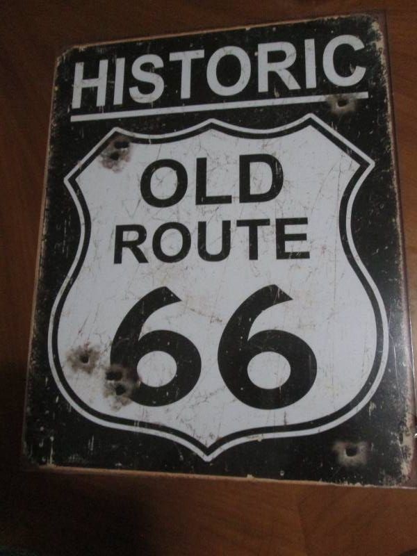 Route 66 metal sign measures 12 x 14 inches