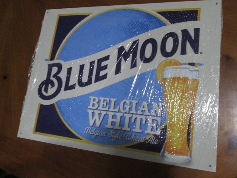 Blue Moon metal sign measures 12 x 14 inches