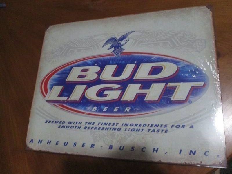 Bud Light metal sign with authenticity sticker measures 12 x 14 inches