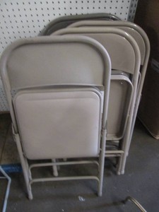 5 Folding chairs, one with a padded seat