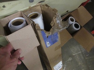 Assorted partial rolls of paper for a photo printer