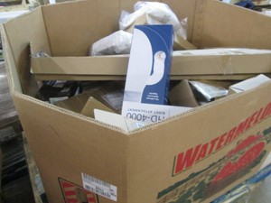 Untouched pallet of clearance and damaged package items, appears to be mainly bath and tile items