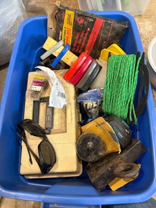 Tote of random garage stuff