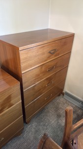 Tall Wooden Four-Drawer Dresser with Metal Pulls